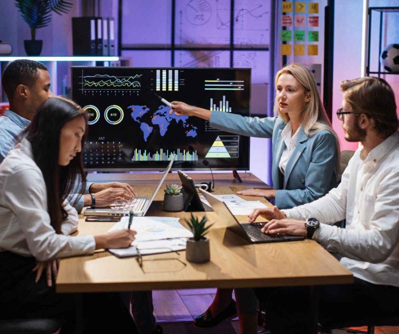 multiracial-partners-discussing-financial-project-2024-12-13-05-56-26-utc