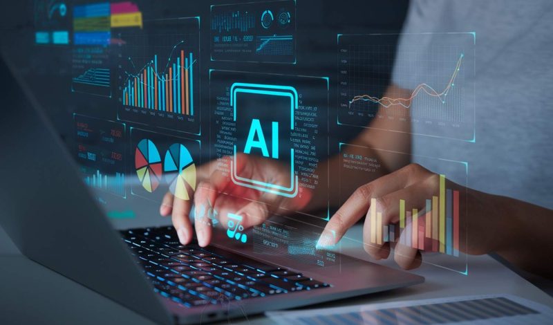 person-is-typing-laptop-with-screen-showing-graph-graph