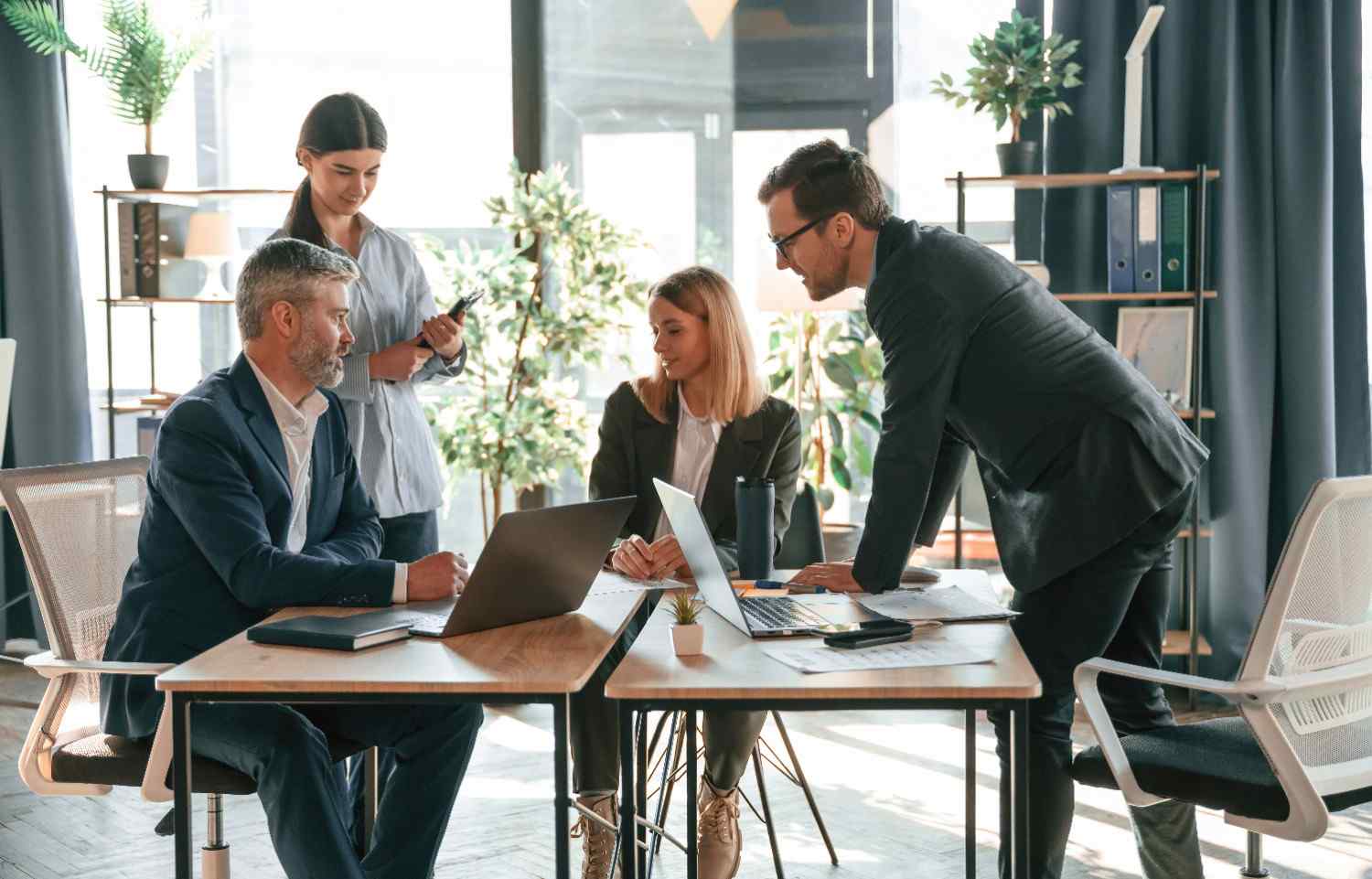 busy-workers-are-by-the-table-group-of-business-p-2025-03-18-20-22-14-utc (1)