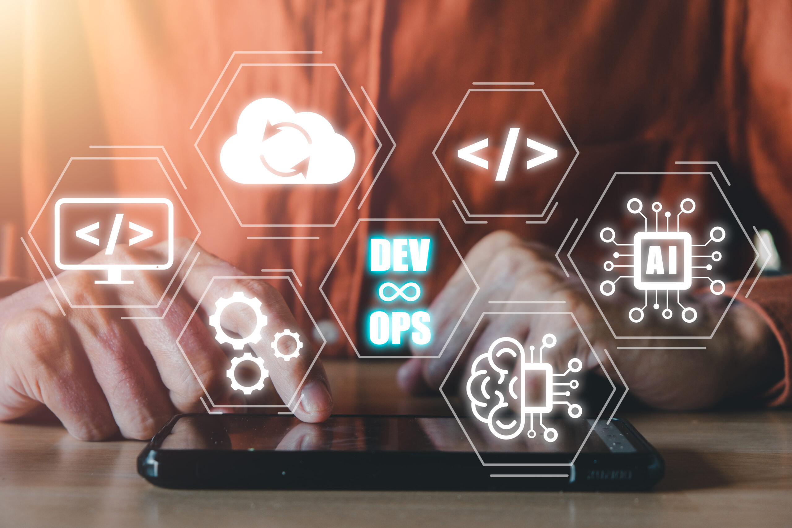DevOps concept, Man hand touching smartphone with DevOps icon on VR screen on desk, Methodology development operations agil programming technology.concept.