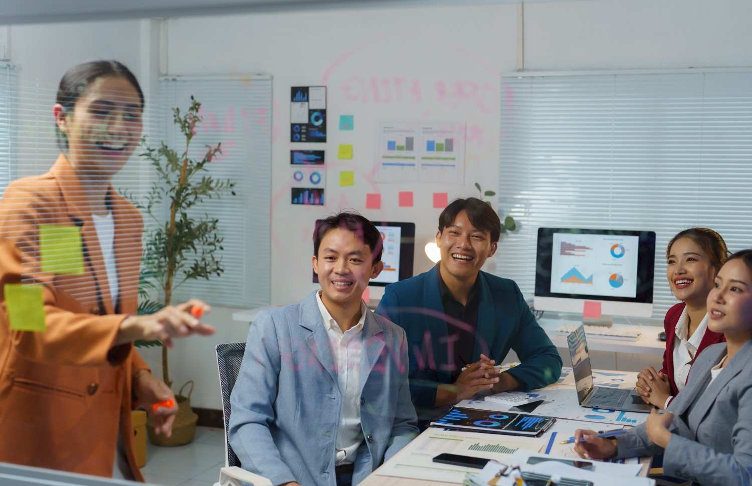 happy-asian-businesswoman-leading-a-brainstorming-2025-02-20-08-00-00-utc